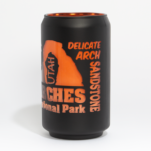 Black can cooler with orange text and Utah Arches National Park design on a white background