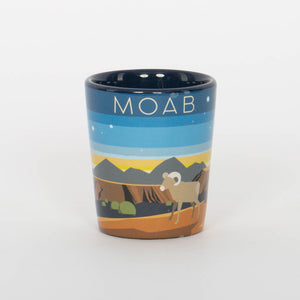Ceramic mug with a landscape design and 'MOAB' text on a white background