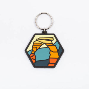 Hexagonal keychain with a colorful design on a white background
