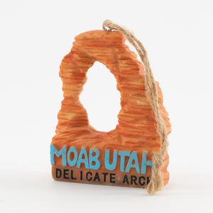 Decorative arch shaped like a desert arch with 'Moab Utah Delicate Arch' text on a white background