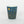 Teal mug with gold and white designs on a white background