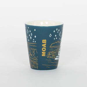 Blue mug with gold graphics and 'MOAB' text on a white background