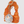 Keychain with a circular pendant featuring illustrations of animals and text, attached to an orange rock-like object.