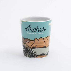 Ceramic mug with Arches National Park design on a white background