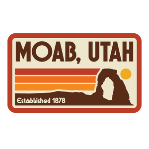 Logo of Moab, Utah with a silhouette of a arch and sunset