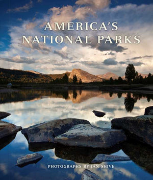 America's National Parks book by Simon & Schuster, front cover with a mountain lake at dusk