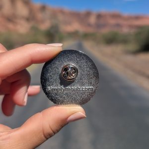 Back of the Arches National Park 1929 medallion enamel pin showing the rubber clutch and simplymoab.com stamp.