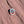 Oval Arches National Park Utah USA enamel pin with Delicate Arch against a blue sky, lying on red sandstone in Moab, Utah.