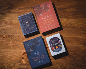The Campfire Stories book series laid out on a wooden table, including the Kids edition