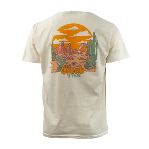 Image One Mountain Meadow Adult T-Shirt in Ivory, back view with an orange Moab Utah desert sunset graphic
