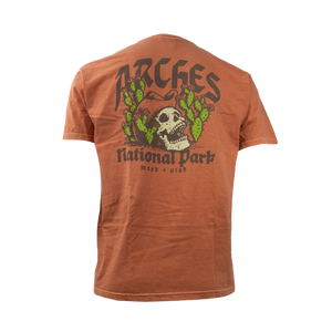 Image One Olde English Cowboy Skull Adult T-Shirt in Yam, back view with a cowboy skull and cactus Arches National Park graphic