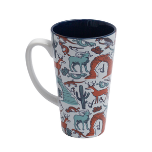 Impact Merchandise Patternalia Latte Mug, a tall mug with a pattern of arches, cacti, bighorn sheep and desert animals