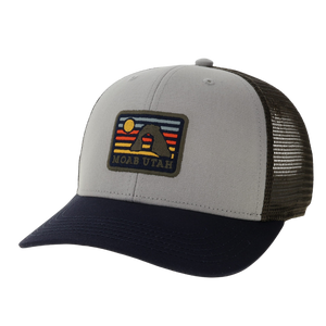 Legacy Alpine Mid-Pro Snapback Hat in gray and navy with a Moab Utah mountain sunset patch, angled view