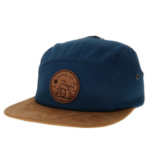 Locale Camper Leather Patch Cap in navy with a tan suede brim and round Moab leather patch, front view