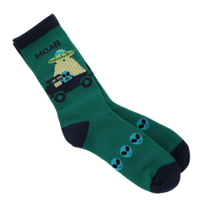 Locale Teal Alien Jeeping in Moab Socks, teal crew socks with a green alien driving a jeep and MOAB lettering