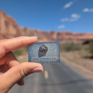 Back of the Moab Utah 1902 enamel pin showing the rubber clutch and simplymoab.com stamp.