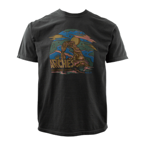 Simply Moab Ray Arches Adult T-Shirt in Pepper, a washed black tee with a colorful Delicate Arch sun rays graphic